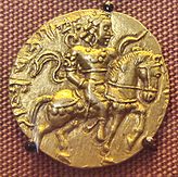 Gold coin of Gupta era, depicting Gupta king Kumaragupta holding a bow.